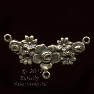 Oxidized stamped brass 3 ring connector in floral garland motif. 26mm x 10mm. Pkg. of 2. b9-0834